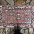 1970s pale red vintage Turkish anatolia rug with traditional design, hand-knotted weave and low pile.