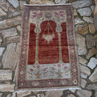 Red 3' x 4' vintage Turkish anatolia rug in wool and cotton, shown on the floor.