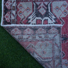1970s red vintage Turkish anatolian rug with traditional design, hand-knotted weave and low pile.