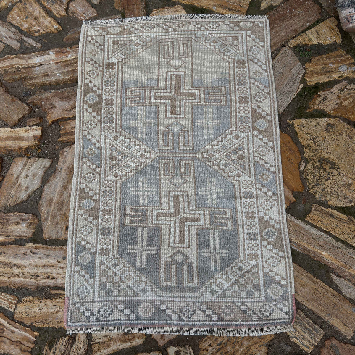 Pale Blue 2' x 4' vintage Turkish anatolian rug in wool and cotton, shown on the floor.