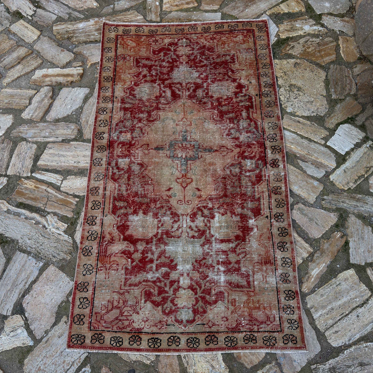 Red 3' x 5' vintage Turkish anatolian rug in wool and cotton, shown on the floor.
