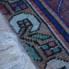 Red 3' x 7' vintage Turkish anatolian rug in wool and cotton, shown on the floor.
