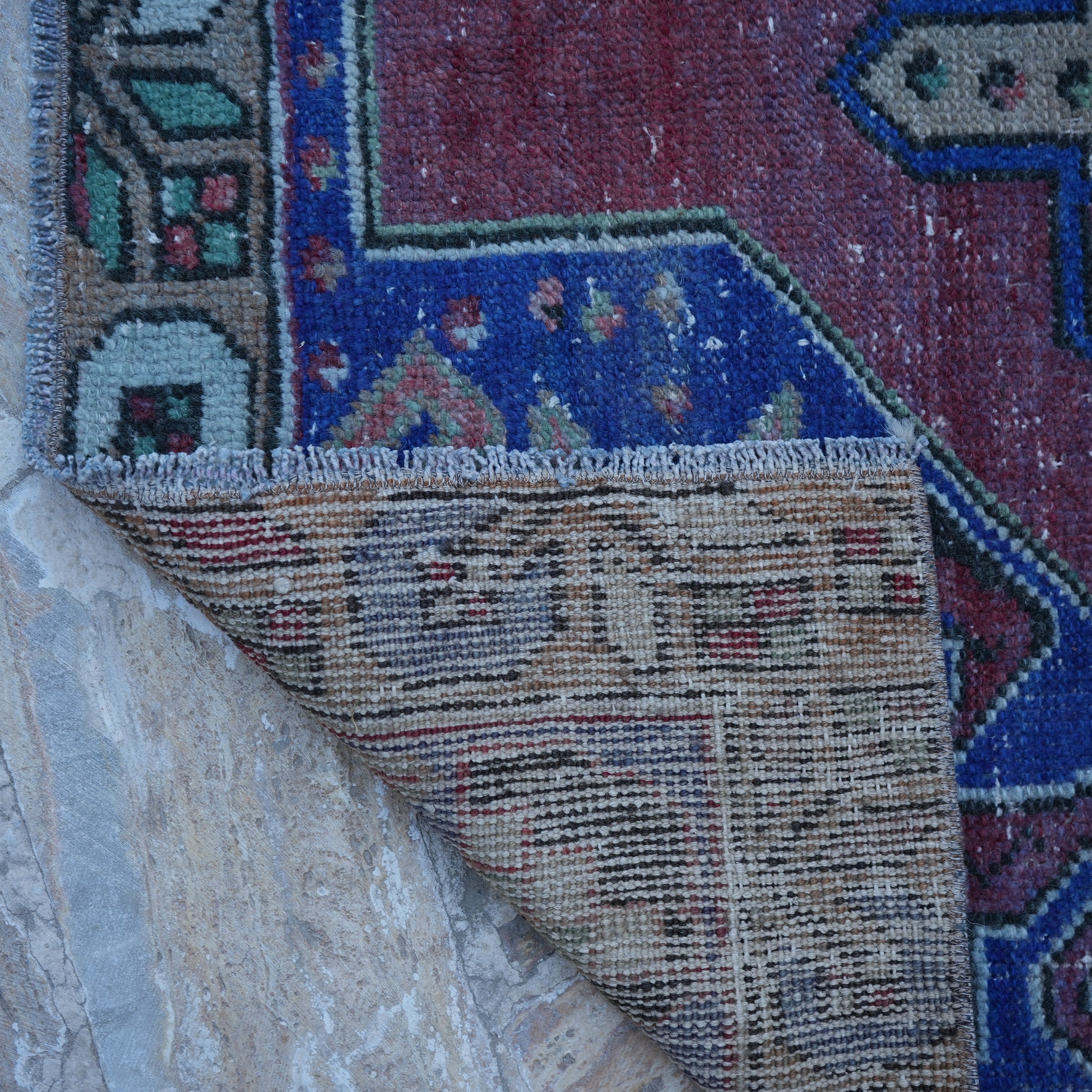 1970s red vintage Turkish anatolian rug with traditional design, hand-knotted weave and low pile.