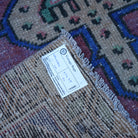 Red 3' x 7' vintage Turkish anatolian rug from the 1970s with traditional design.