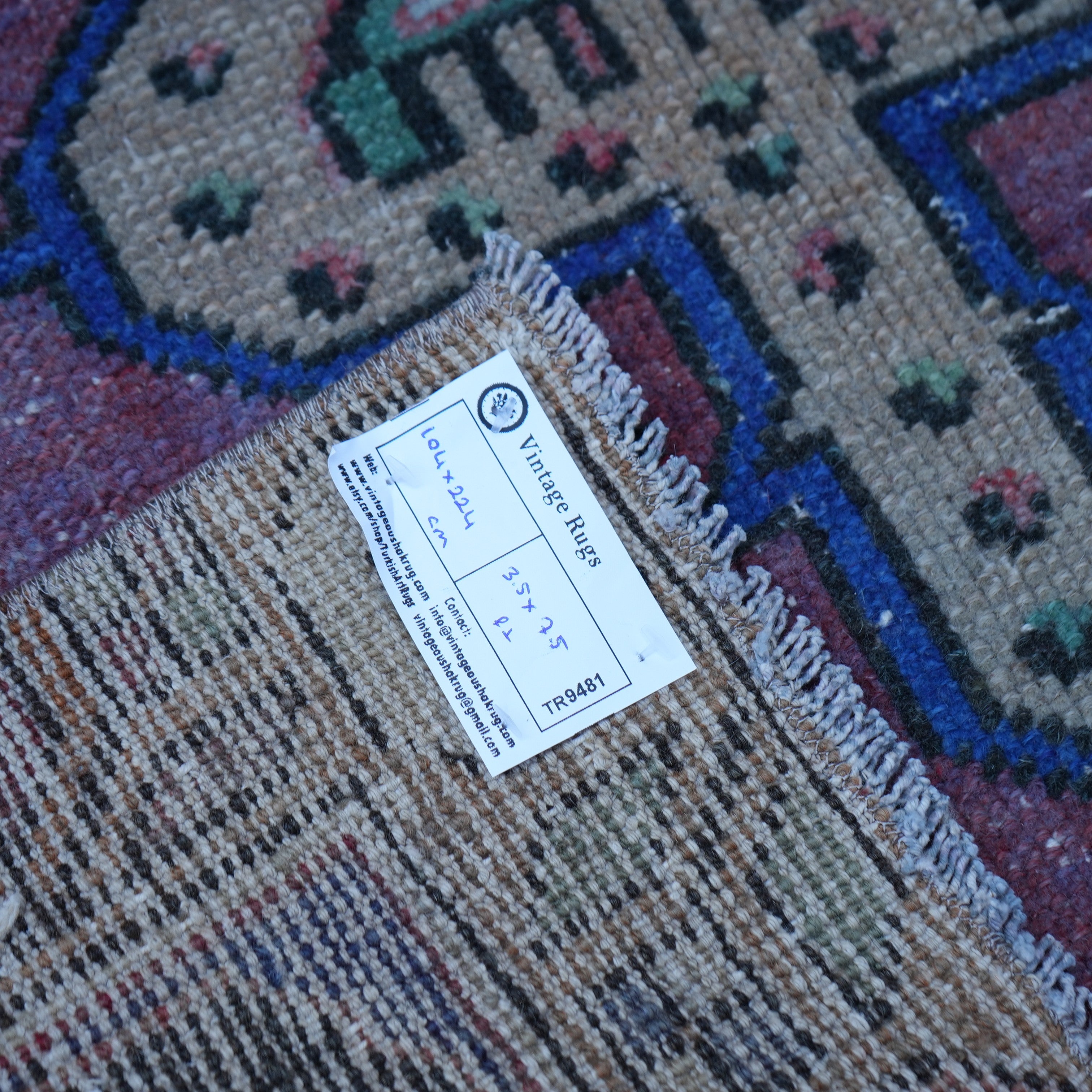Red 3' x 7' vintage Turkish anatolian rug from the 1970s with traditional design.