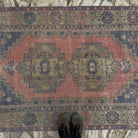 1970s red vintage Turkish anatolian rug with traditional design, hand-knotted weave and low pile.