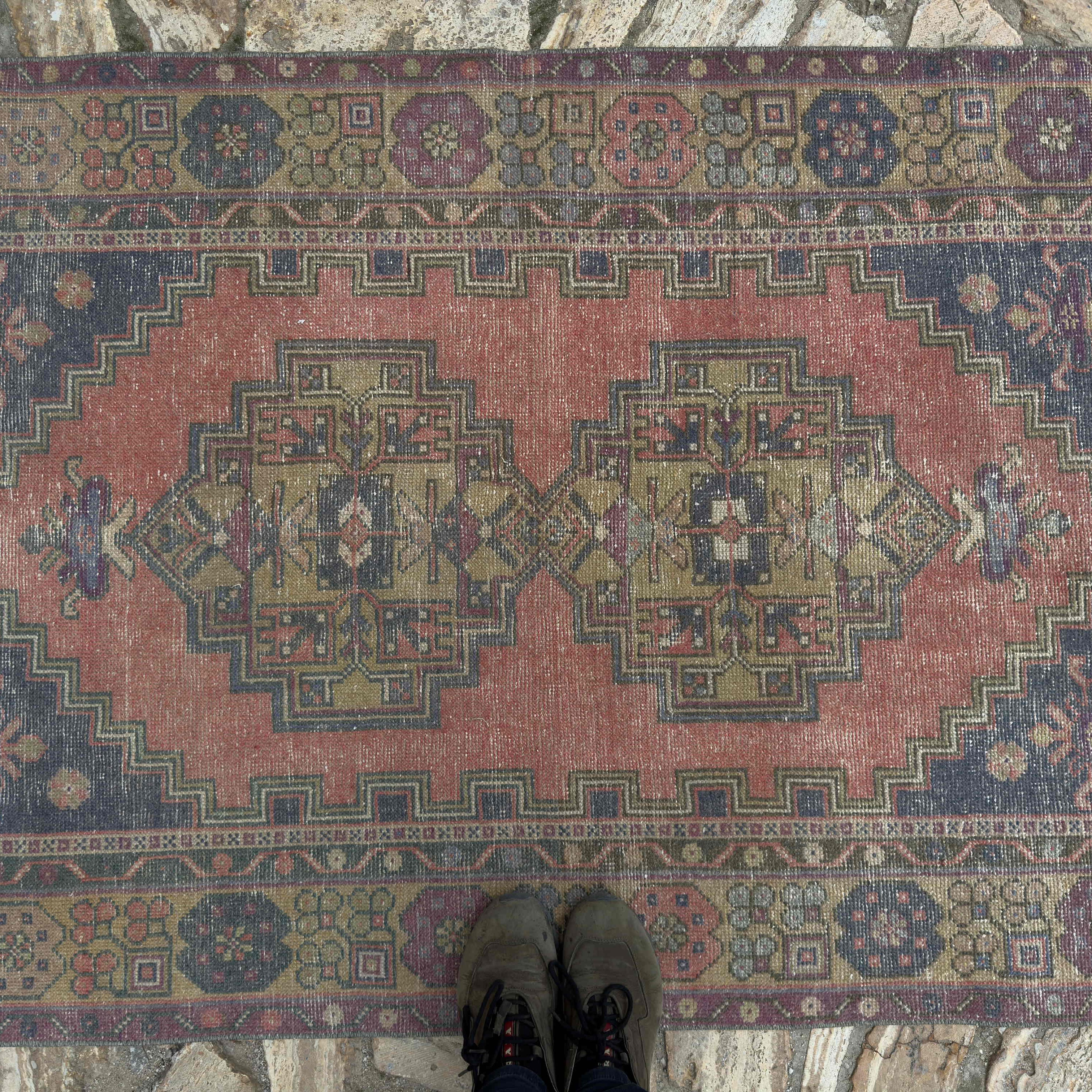 1970s red vintage Turkish anatolian rug with traditional design, hand-knotted weave and low pile.
