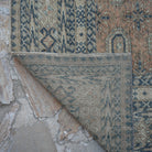 1970s pale orange vintage Turkish anatolian rug with geometric design, hand-knotted weave and low pile.