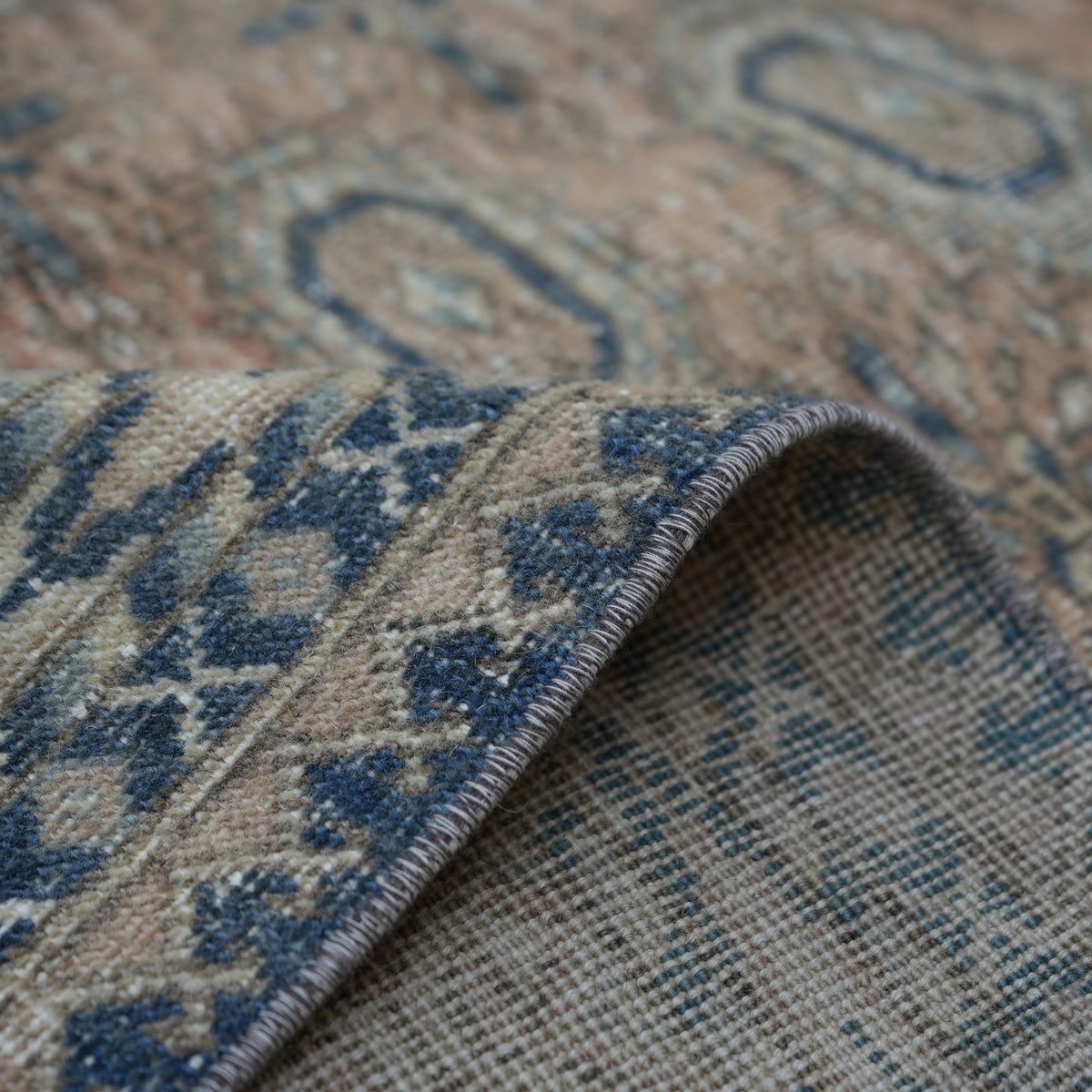 Additional view of the pale orange vintage Turkish anatolian rug, hand-knotted in wool and cotton.