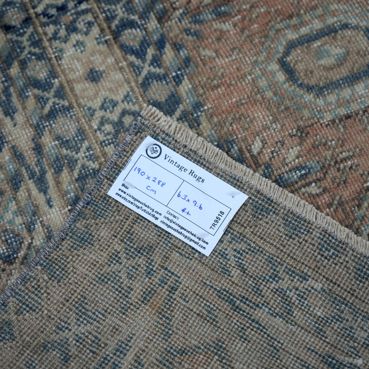 Pale Orange 6' x 9' vintage Turkish anatolian rug from the 1970s with geometric design.