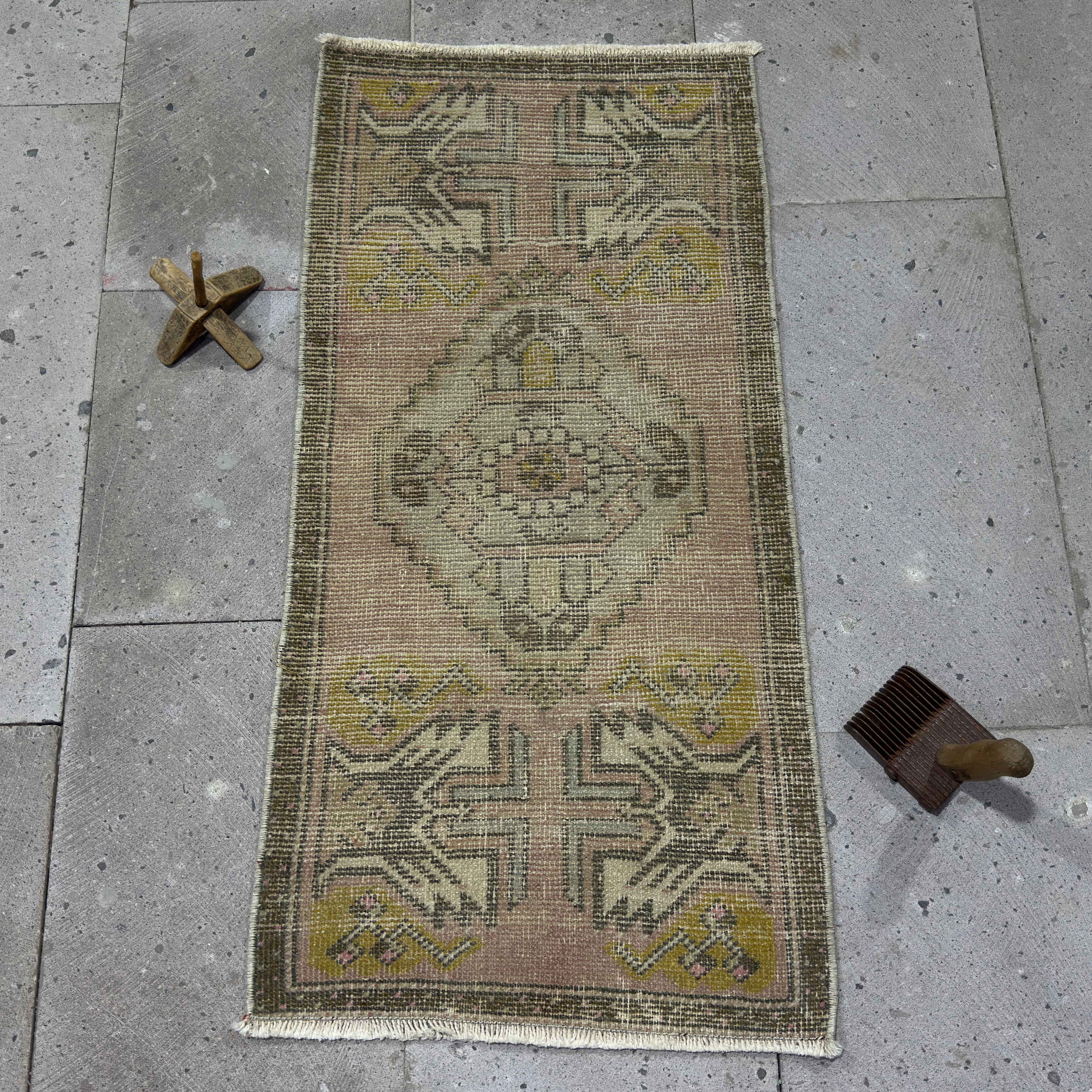 Red 2' x 3' vintage Turkish area carpet in wool and cotton, shown on the floor.