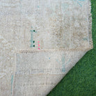 Additional view of the beige vintage Turkish area rug, hand-knotted in wool and cotton.