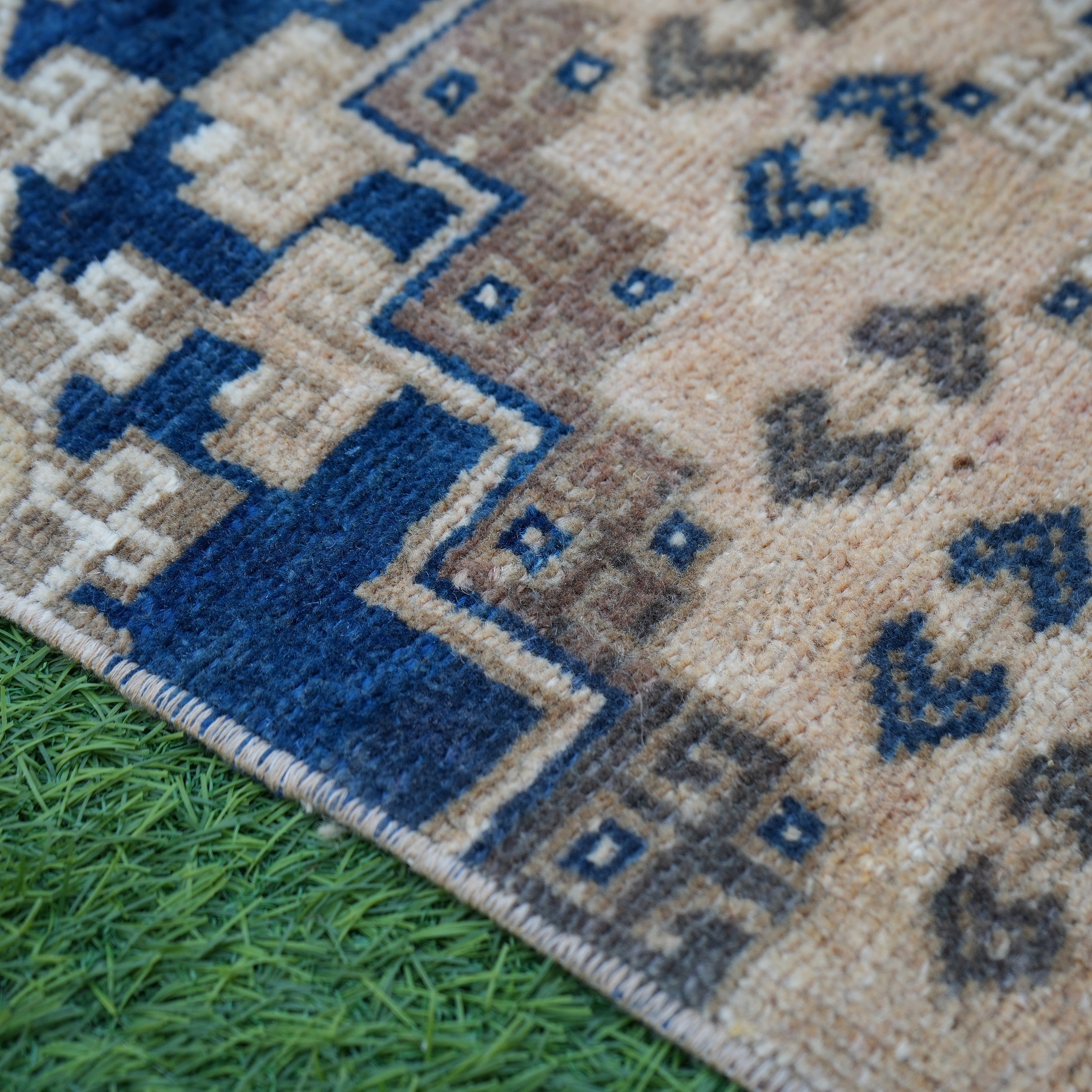 Blue 2' x 3' vintage Turkish area rug in wool and cotton, shown on the floor.
