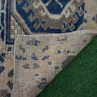 1970s blue vintage Turkish area rug with traditional design, hand-knotted weave and low pile.