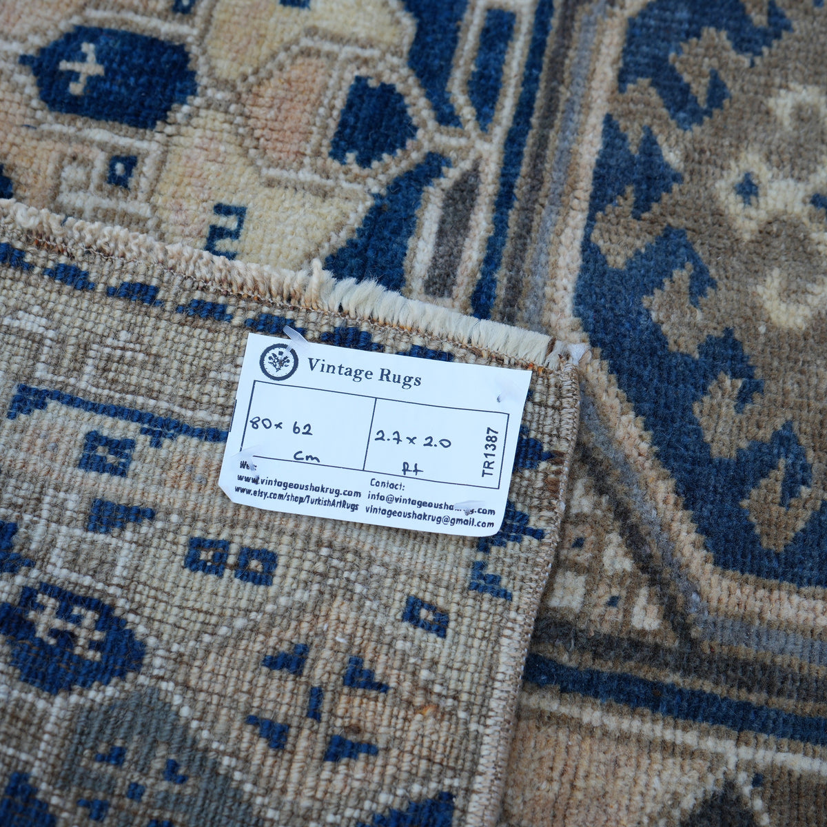 Blue 2' x 3' vintage Turkish area rug from the 1970s with traditional design.