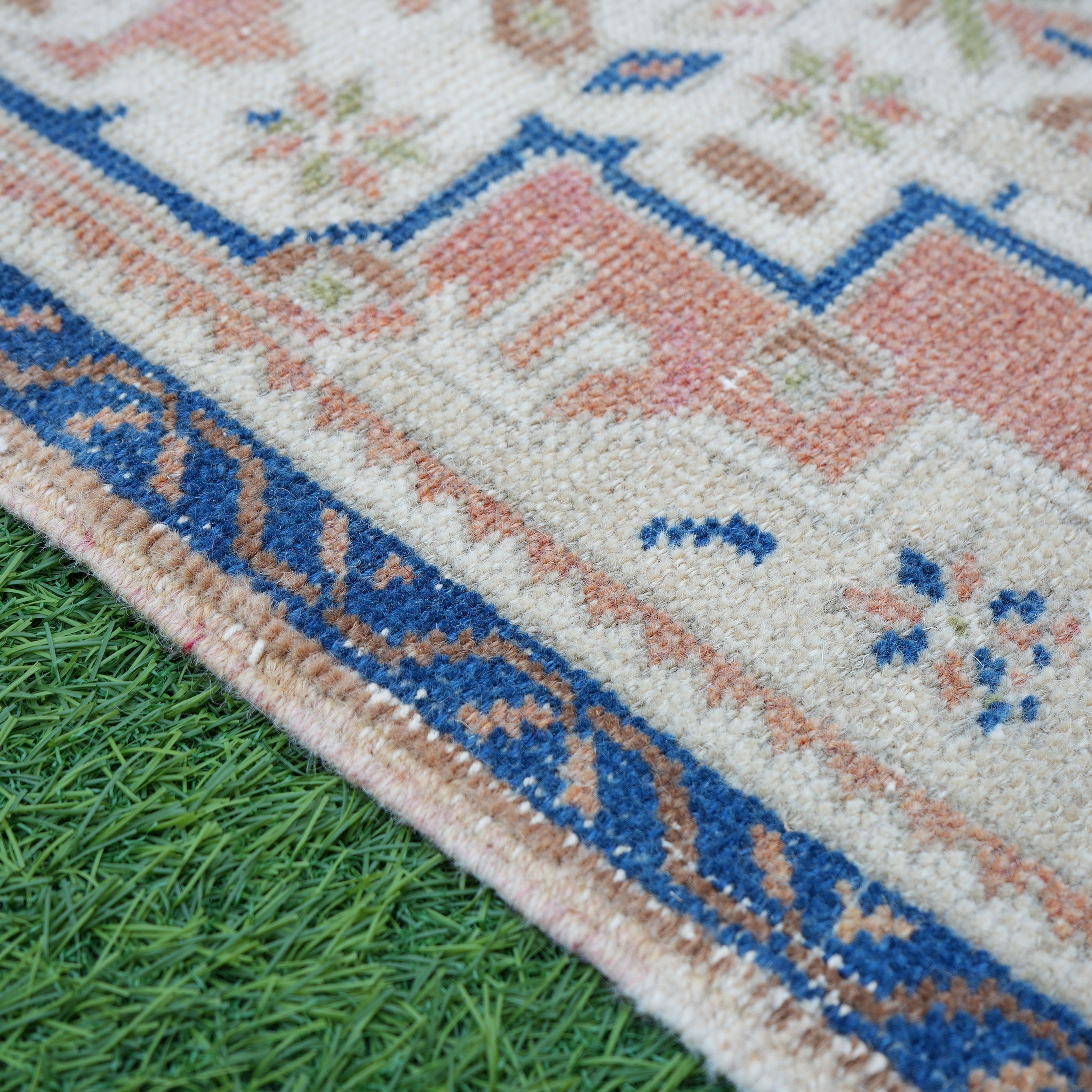 Blue 2' x 3' vintage Turkish area rug in wool and cotton, shown on the floor.