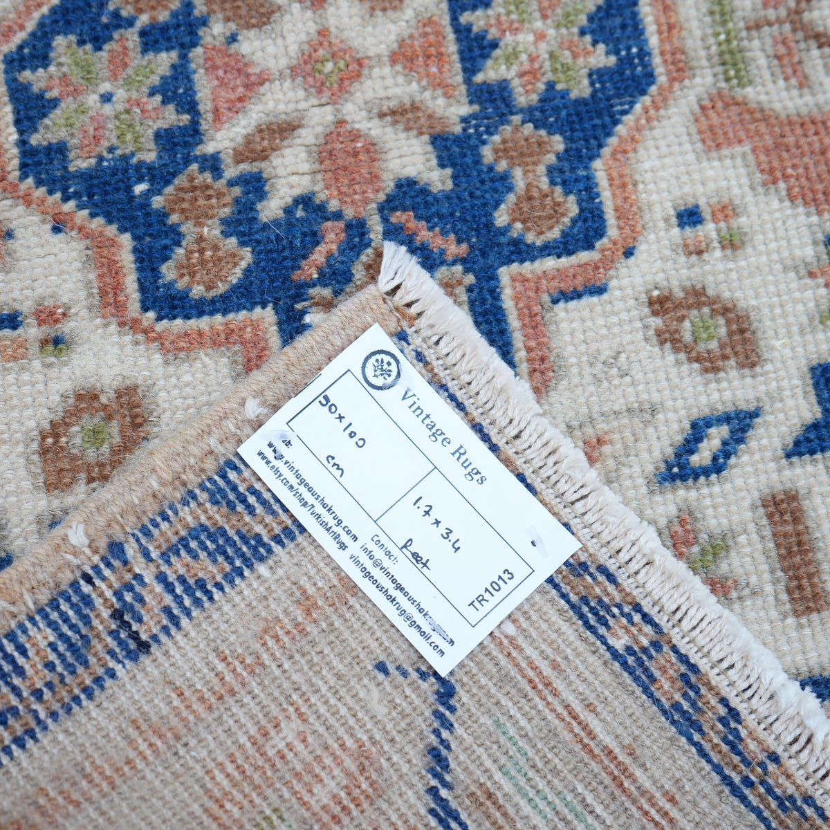 Blue 2' x 3' vintage Turkish area rug from the 1970s with traditional design.