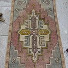 1970s red vintage Turkish area rug with medallion design, hand-knotted weave and low pile.