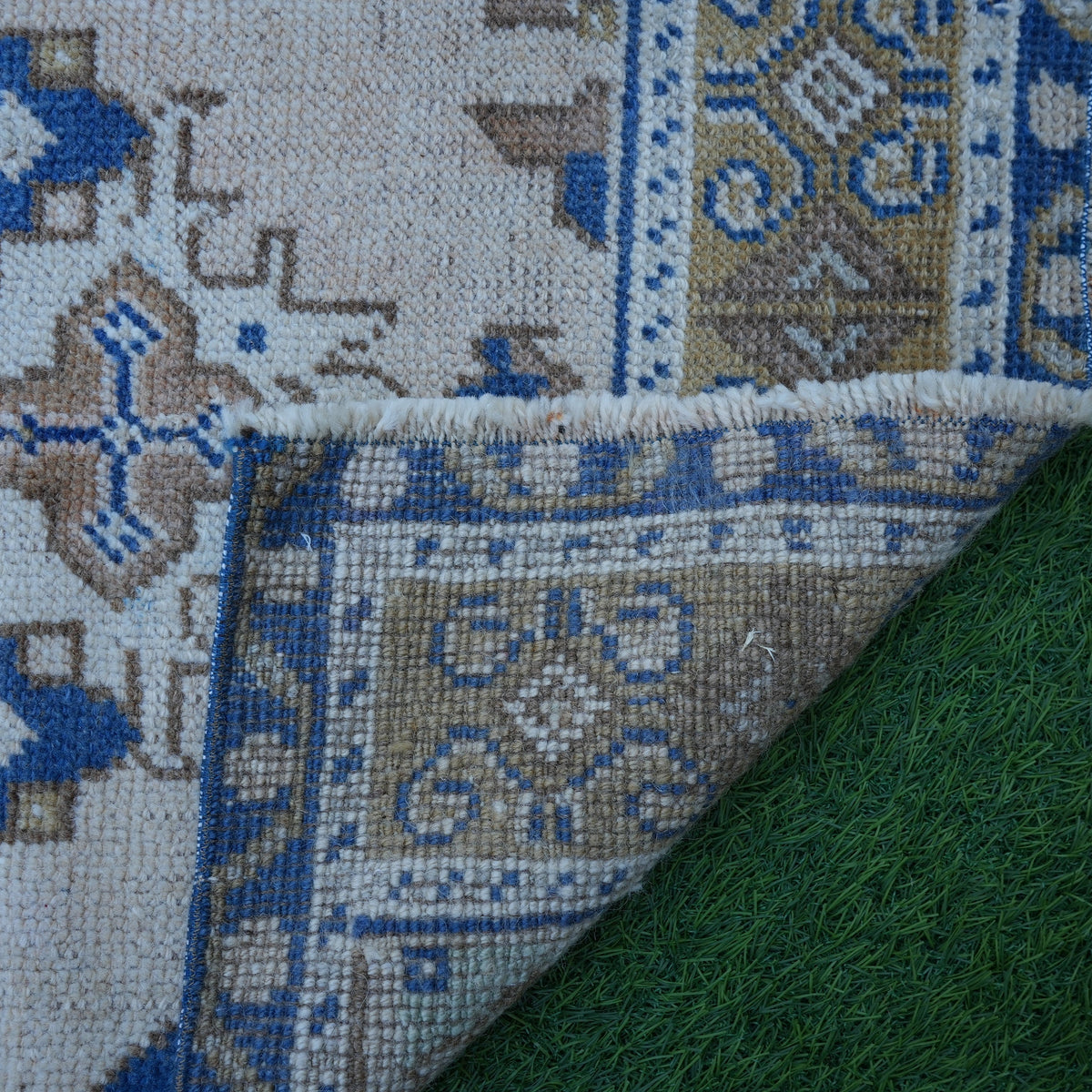 1970s blue vintage Turkish area rug with traditional design, hand-knotted weave and low pile.