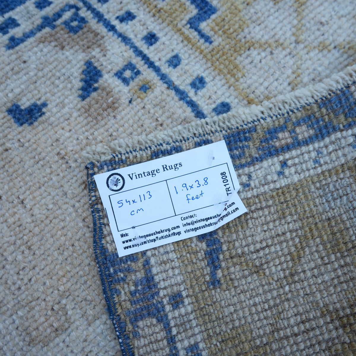 Blue 2' x 4' vintage Turkish area rug from the 1970s with traditional design.
