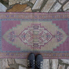 1970s pale pink vintage Turkish area rug with traditional design, hand-knotted weave and low pile.