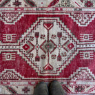 1970s red vintage Turkish area rug with geometric design, hand-knotted weave and low pile.