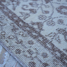 Beige 3' x 6' vintage Turkish area rug in wool and cotton, shown on the floor.
