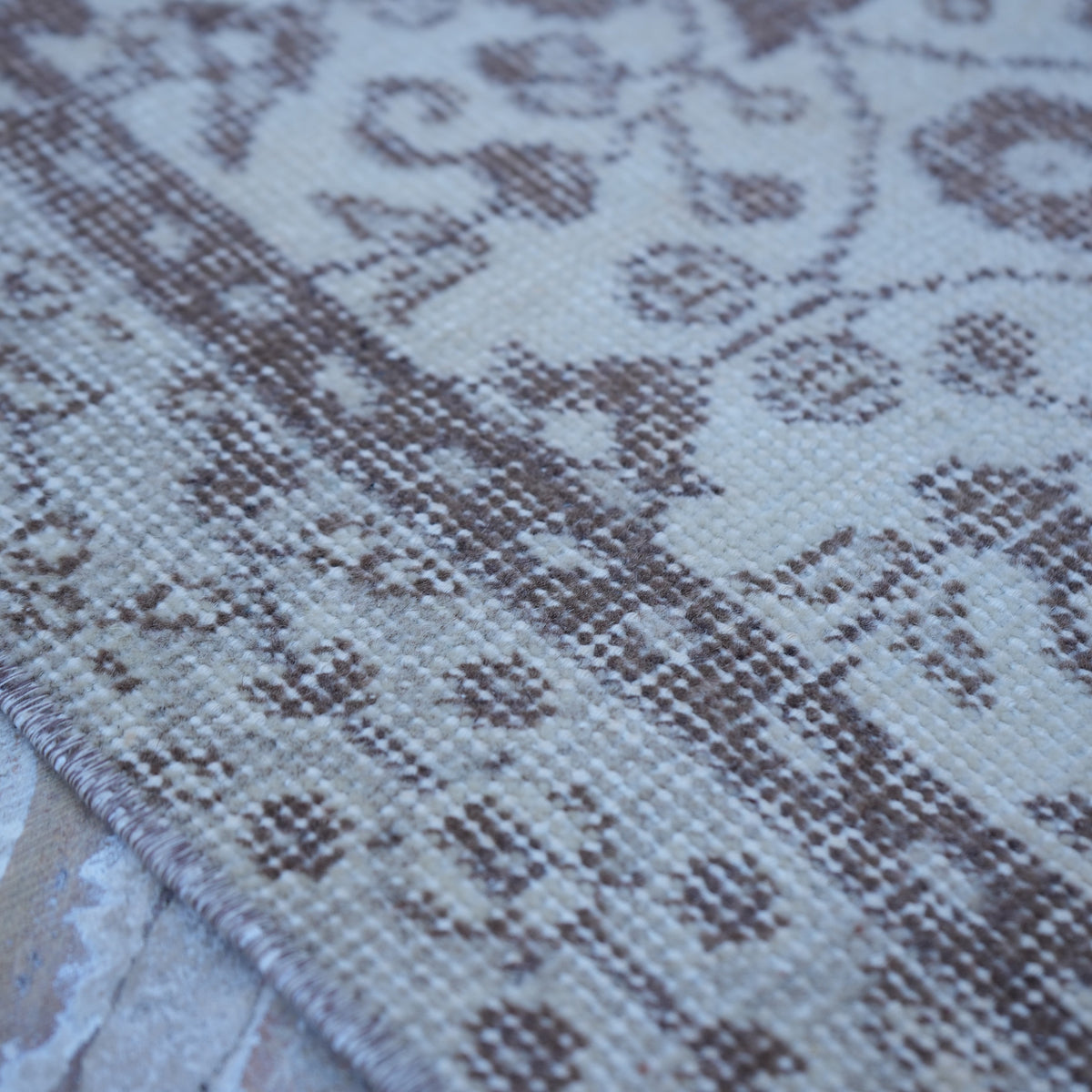 Beige 3' x 6' vintage Turkish area rug in wool and cotton, shown on the floor.