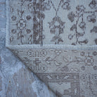 1970s beige vintage Turkish area rug with traditional design, hand-knotted weave and low pile.