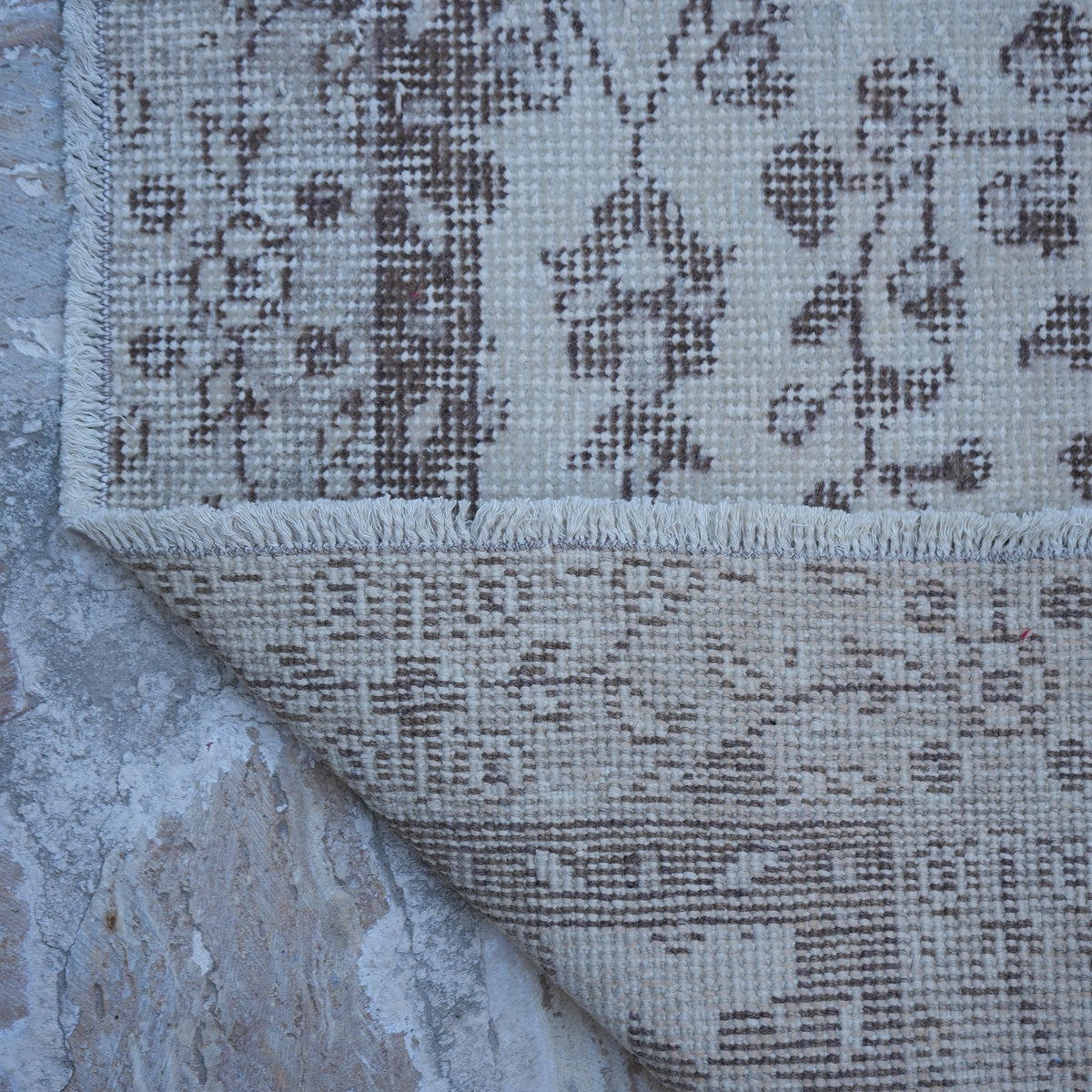 1970s beige vintage Turkish area rug with traditional design, hand-knotted weave and low pile.