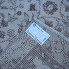 Beige 3' x 6' vintage Turkish area rug from the 1970s with traditional design.