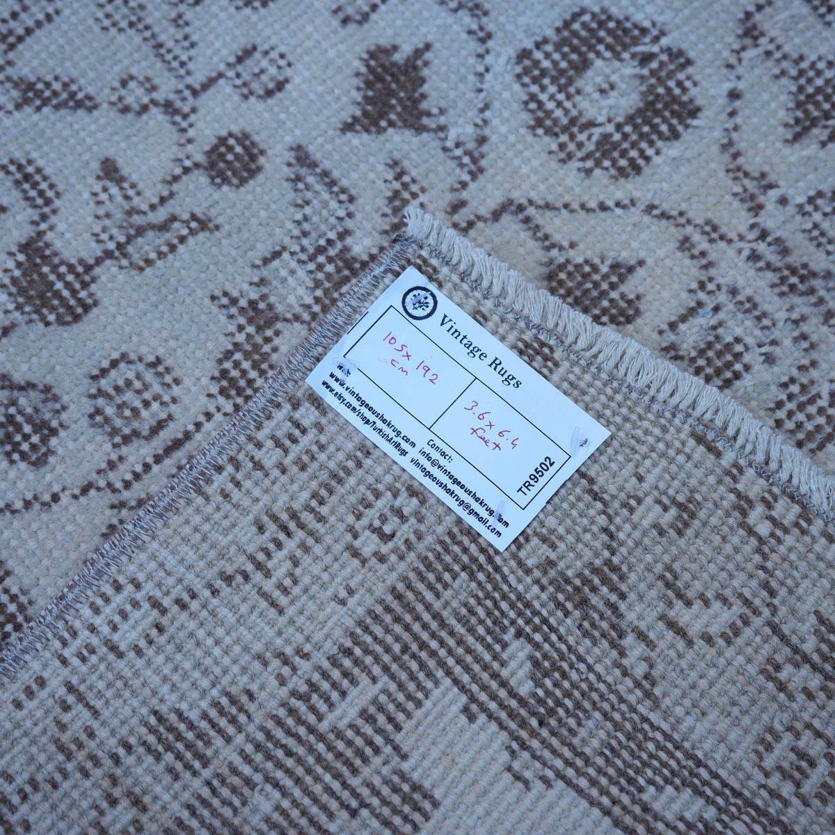 Beige 3' x 6' vintage Turkish area rug from the 1970s with traditional design.
