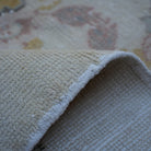 Additional view of the beige vintage Turkish area rug, hand-knotted in wool and cotton.