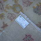 Beige 3' x 6' vintage Turkish area rug from the 1970s with traditional design.