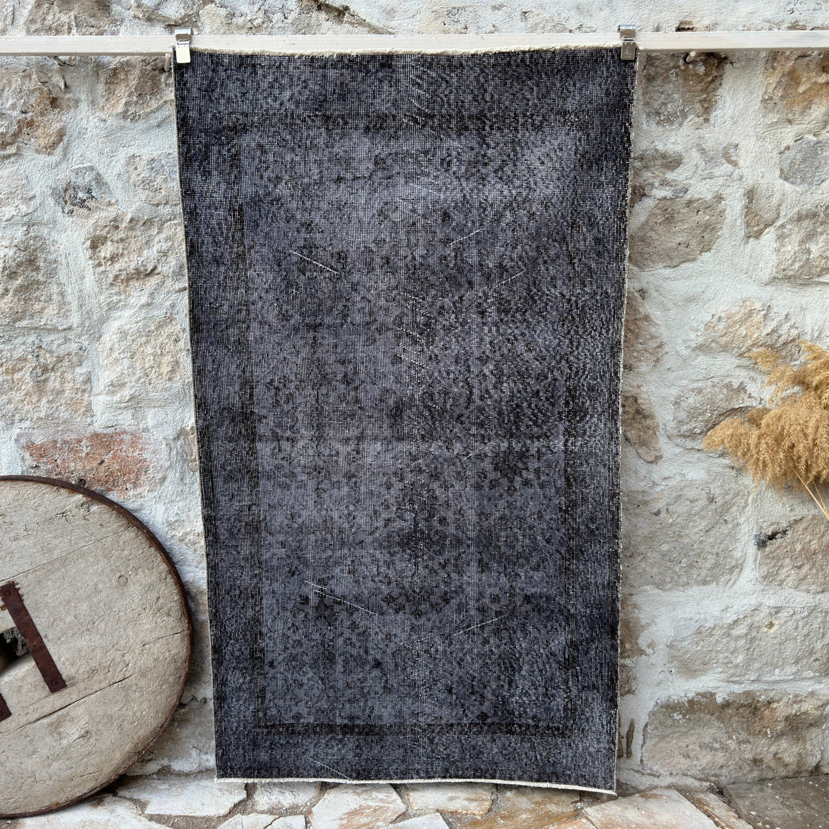 Black 4' x 6' vintage area rug with overdyed design, handmade in Turkey – Charley.