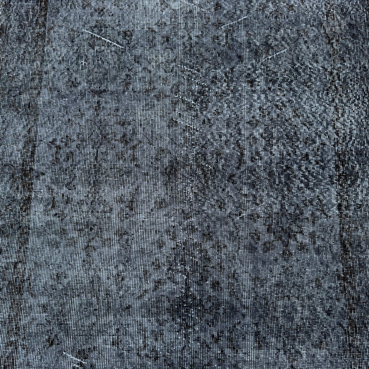 1970s black vintage Turkish area rug with overdyed design, hand-knotted weave and low pile.