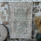 Green 4' x 6' vintage area rug with floral design, handmade in Turkey – Bella.