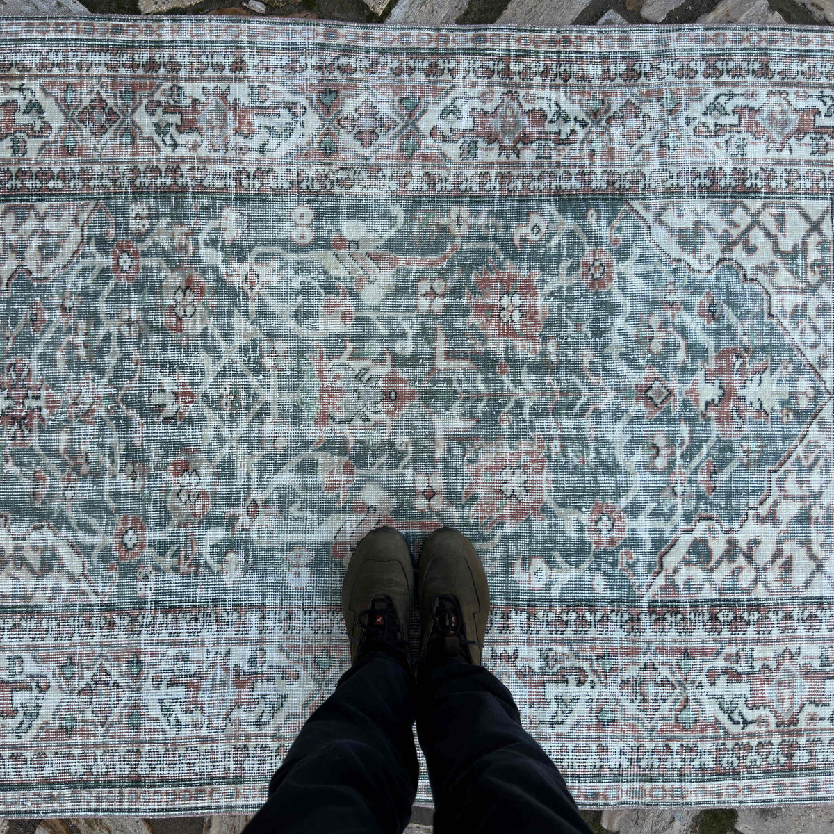 1970s green vintage Turkish area rug with floral design, hand-knotted weave and low pile.