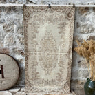 Beige 4' x 7' vintage area rug with medallion design, handmade in Turkey – Lark.