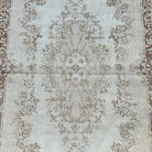 1970s beige vintage Turkish area rug with medallion design, hand-knotted weave and low pile.