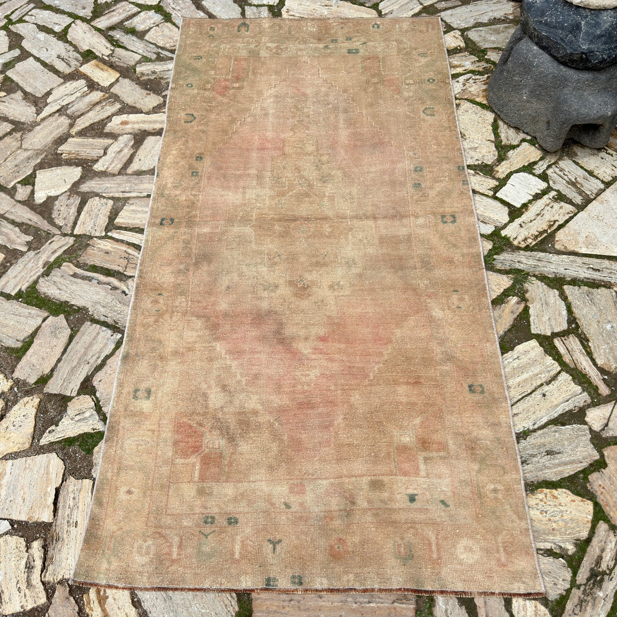Brown 4' x 7' vintage Turkish area rug in wool and cotton, shown on the floor.
