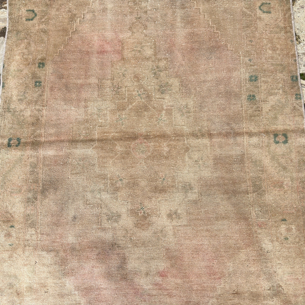 1970s brown vintage Turkish area rug with neutral design, hand-knotted weave and low pile.