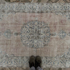 Pale Blue 4' x 7' vintage Turkish area rug in wool and cotton, shown on the floor.