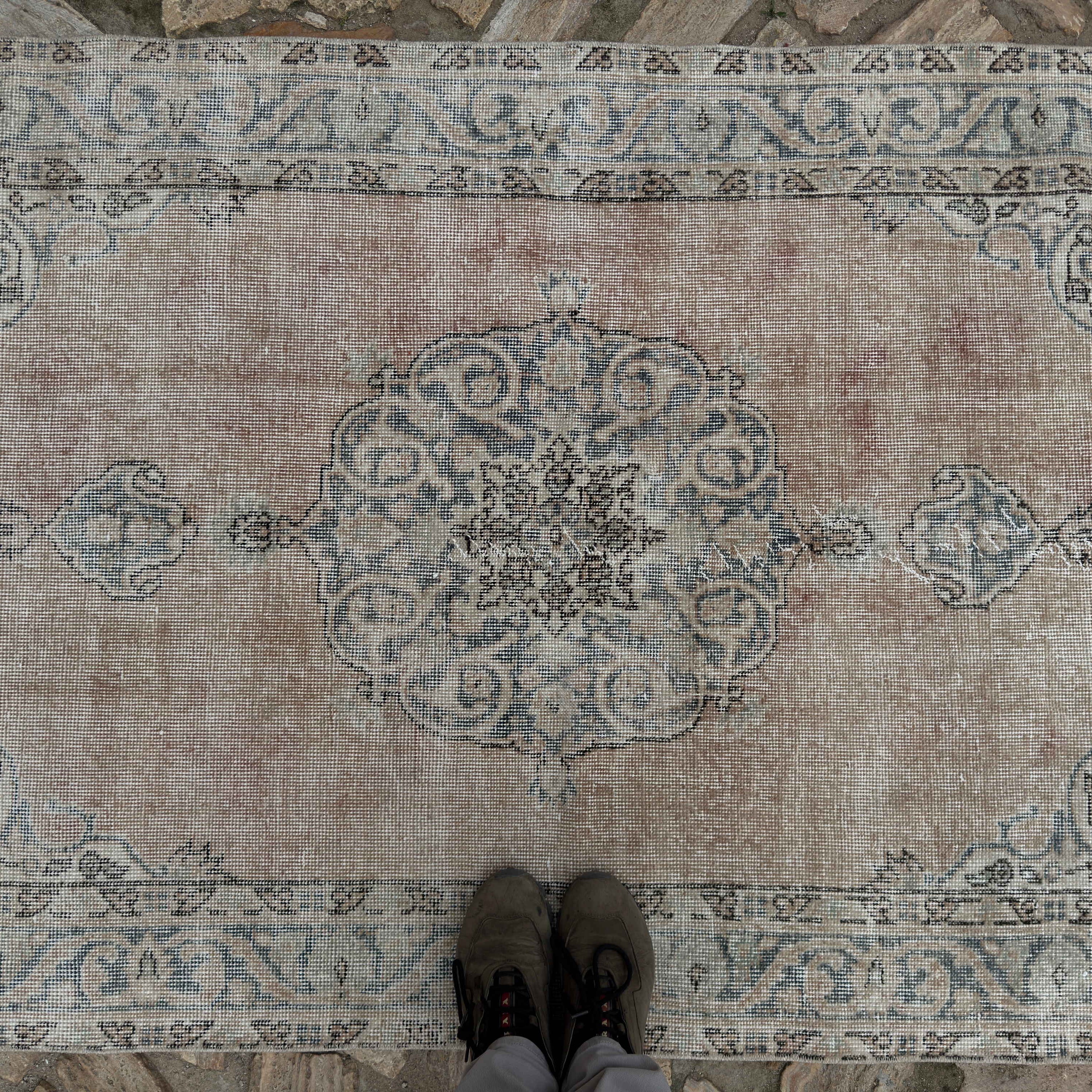 Pale Blue 4' x 7' vintage Turkish area rug in wool and cotton, shown on the floor.