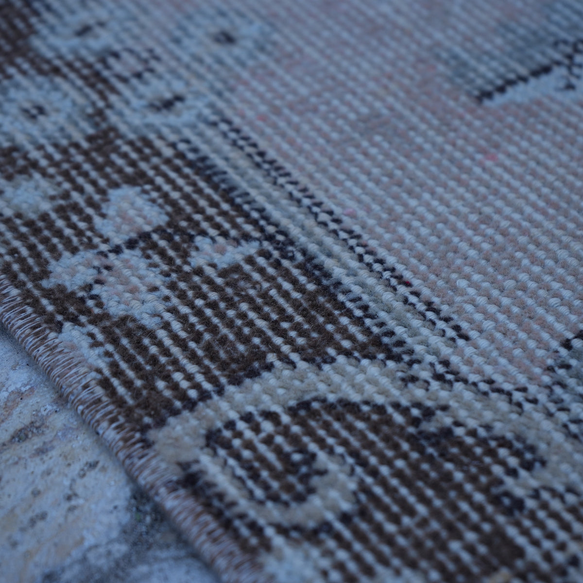 Pink 4' x 7' vintage Turkish area rug in wool and cotton, shown on the floor.