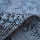 Additional view of the pink vintage Turkish area rug, hand-knotted in wool and cotton.