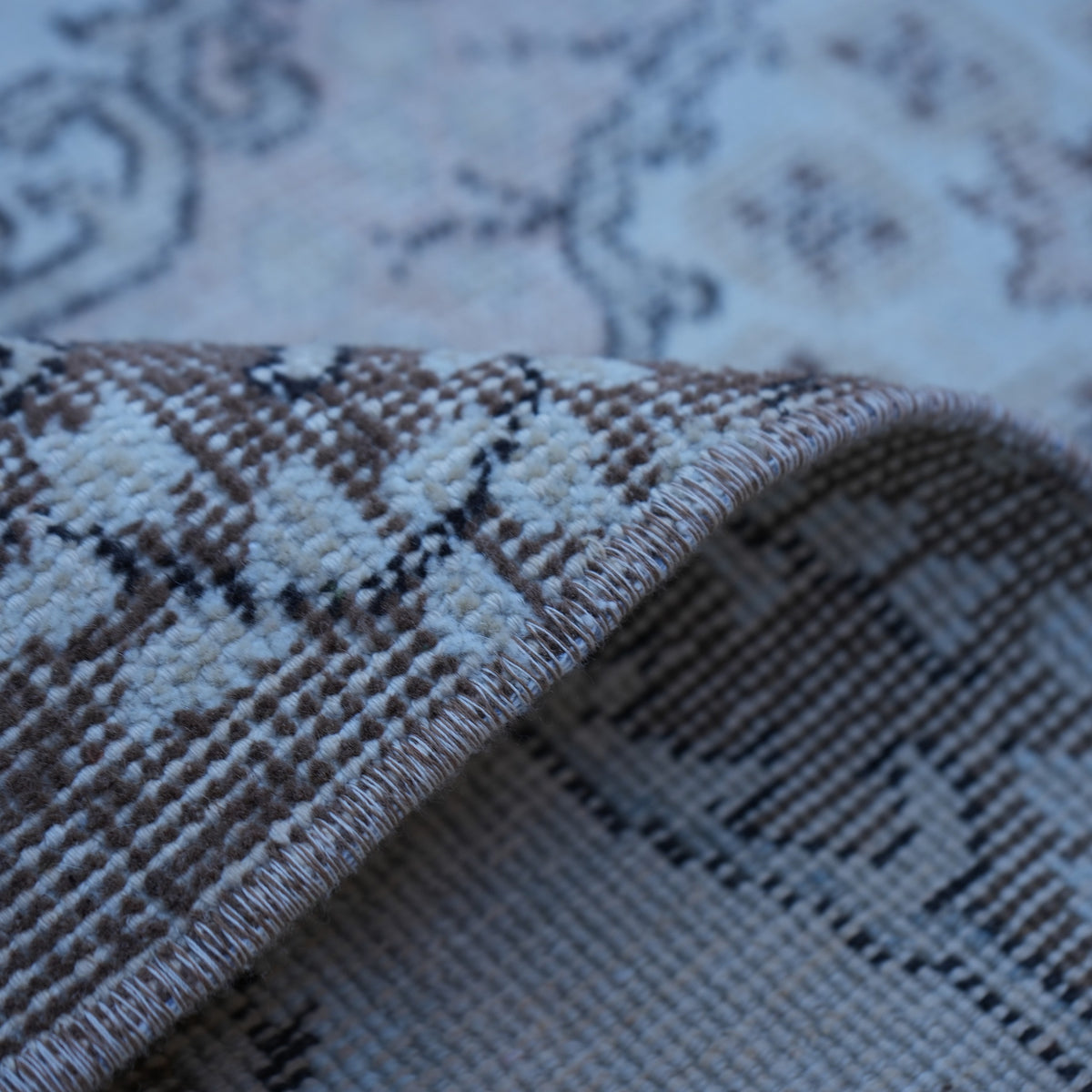 Additional view of the pink vintage Turkish area rug, hand-knotted in wool and cotton.