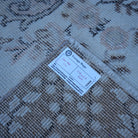Pink 4' x 7' vintage Turkish area rug from the 1970s with traditional design.