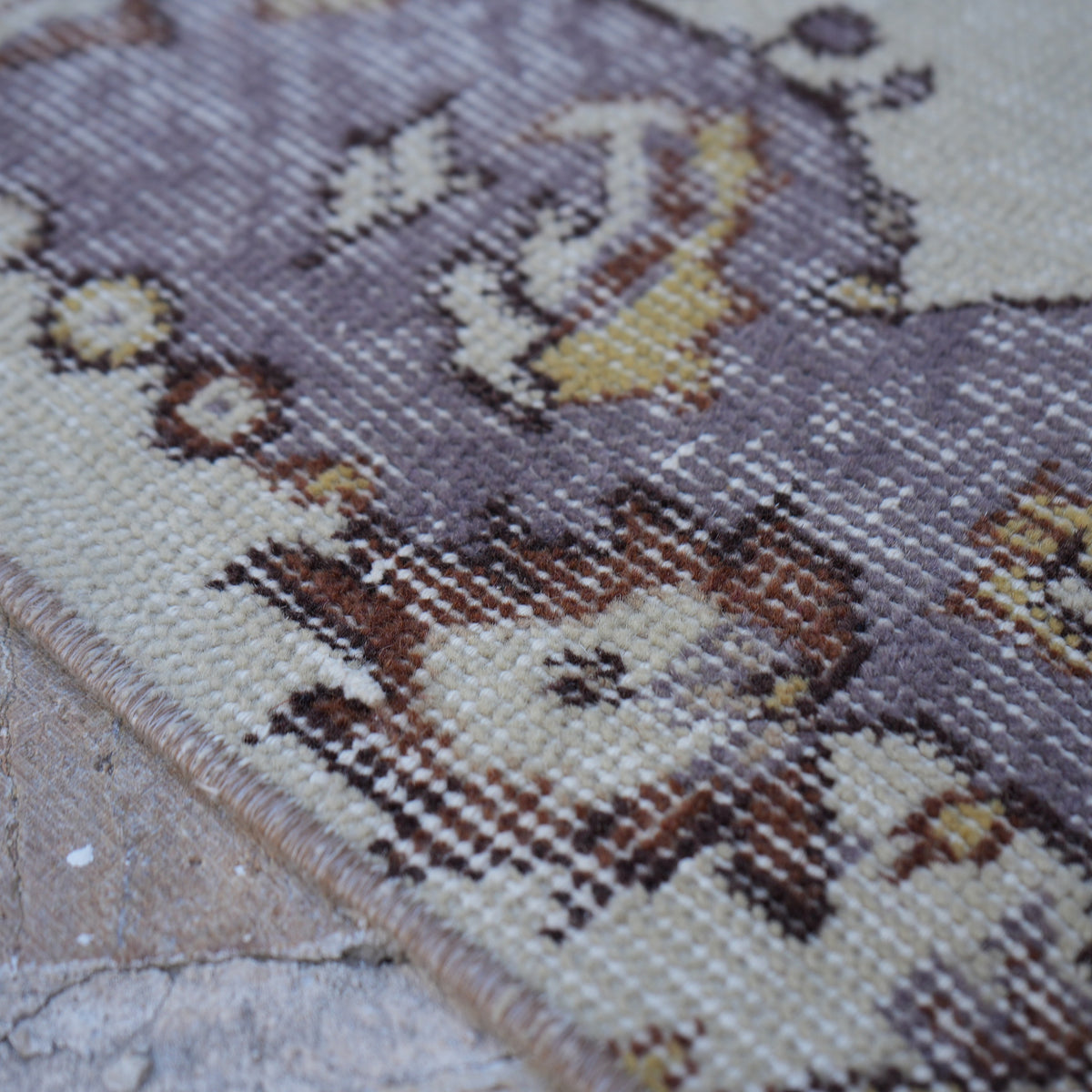 Purple 4' x 7' vintage Turkish area rug in wool and cotton, shown on the floor.