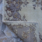 1970s purple vintage Turkish area rug with traditional design, hand-knotted weave and low pile.